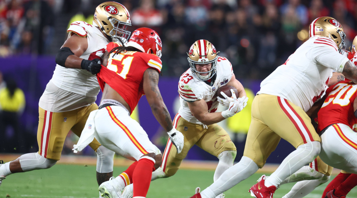 Christian McCaffrey runs with the ball